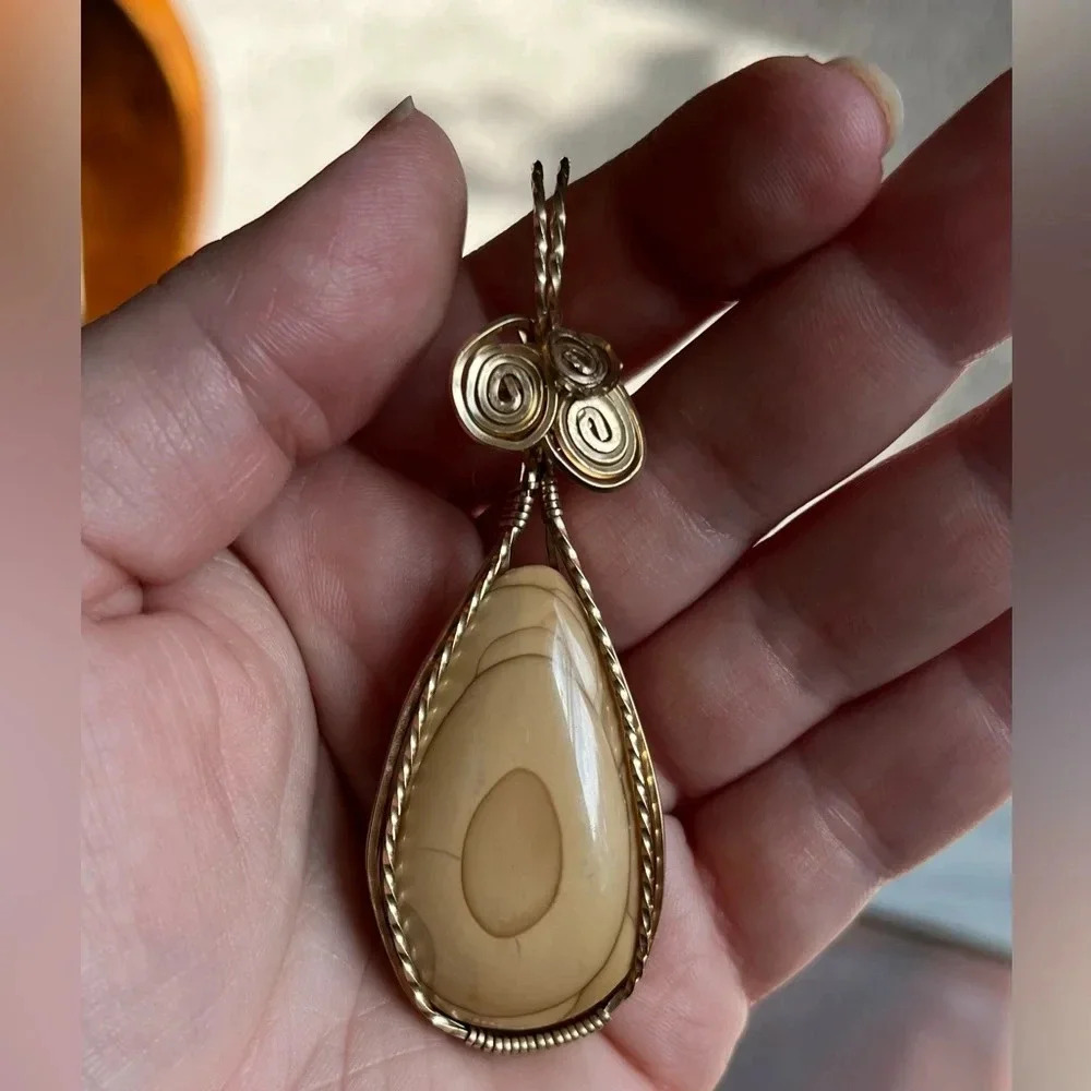 Gold tone wire wrapped semi-precious teardrop stone pendant